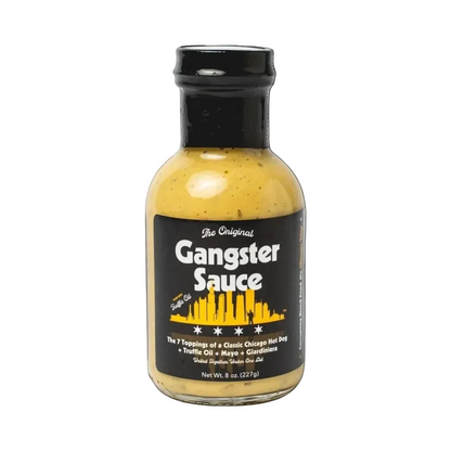 Bottle of Gangster Sauce with black label and yellow sauce on a white background