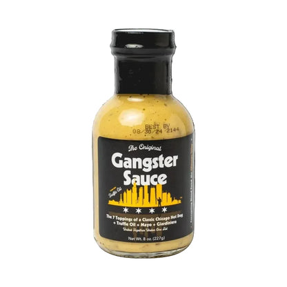 Bottle of Gangster Sauce with black label and yellow sauce on a white background