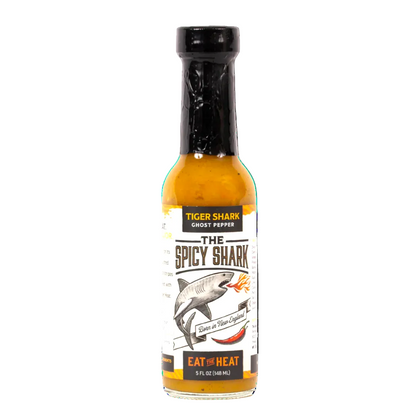 Bottle of 'The Spicy Shark' hot sauce with a tiger shark graphic on a white background