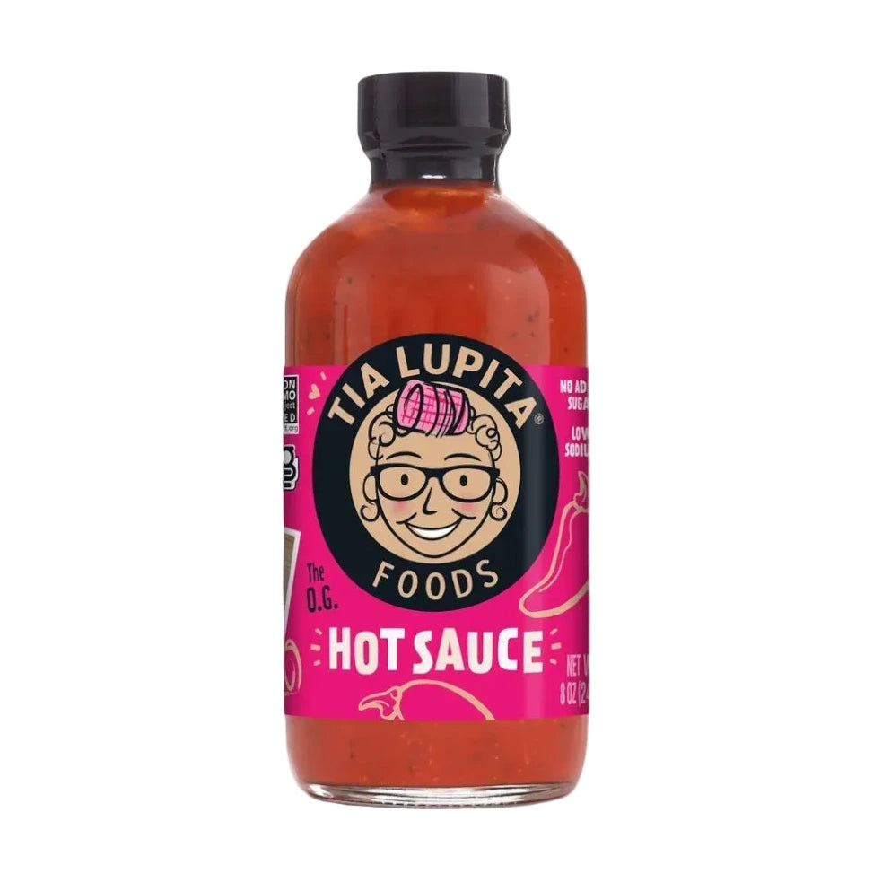 Bottle of Tia Lupita Hot Sauce on a white background