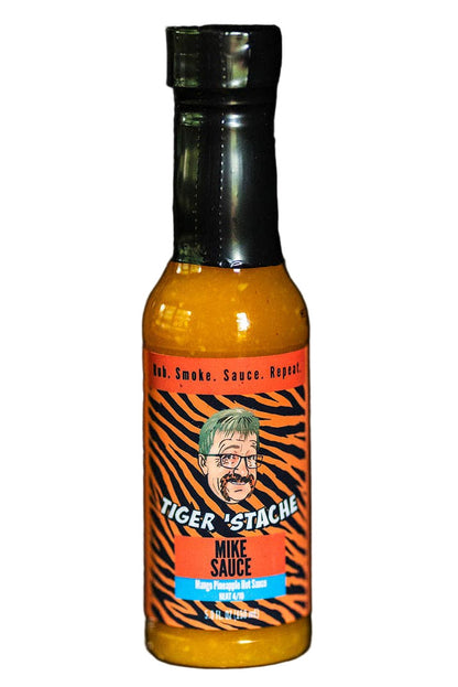 Bottle of Tiger Stache sauce on a black background