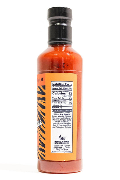 Bottle of Tiger Stache BBQ sauce with a label on a white background