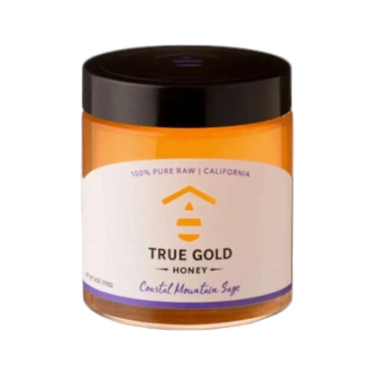 Jar of True Gold Honey with a black lid on a white background