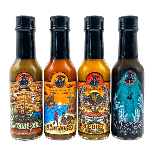 Four Unhallowed hot sauce bottles with colorful labels on a white background