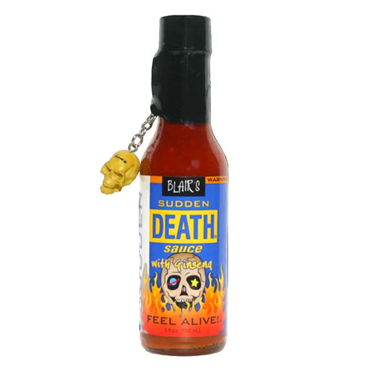 Bottle of Blair's Sudden Death Sauce with a skull charm on a white background