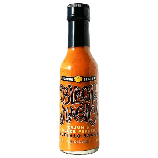 Bottle of Black Magic hot sauce on a white background