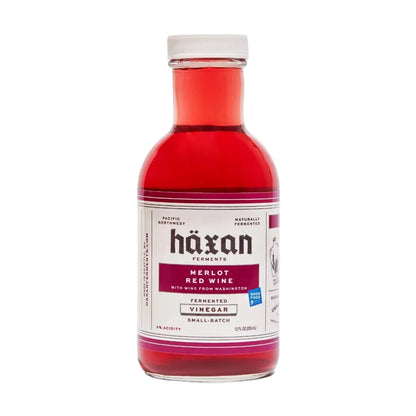 Bottle of Häxan Merlot Red Wine Vinegar on a white background