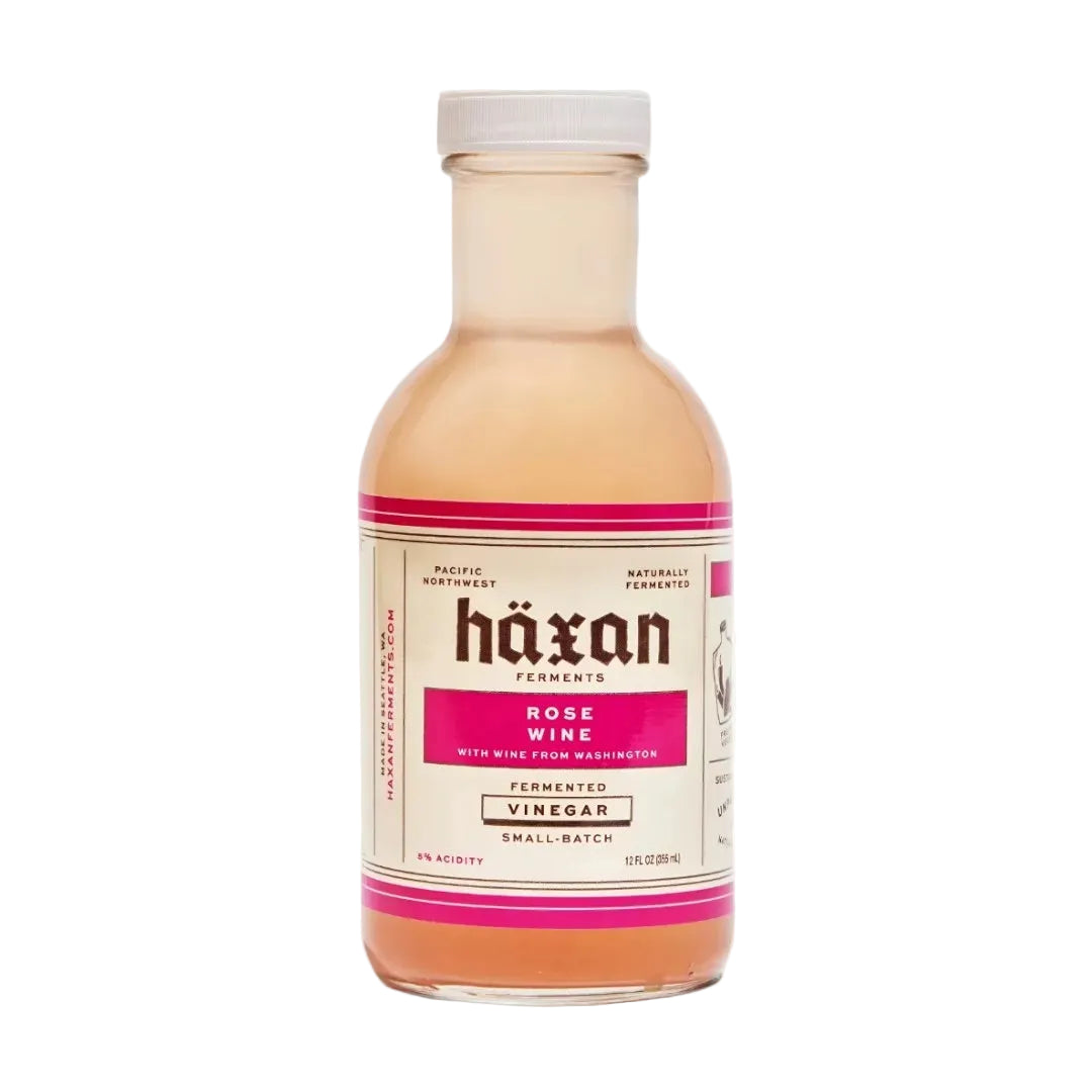 Bottle of Häxan Ferments Rose Wine Vinegar on a white background