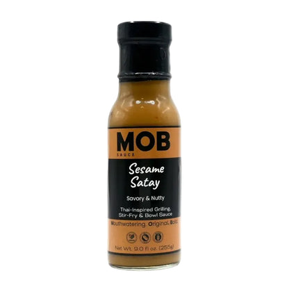 Bottle of MOB Sesame Satay sauce on a white background