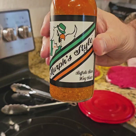 Murph's Wing Sauce pouring display