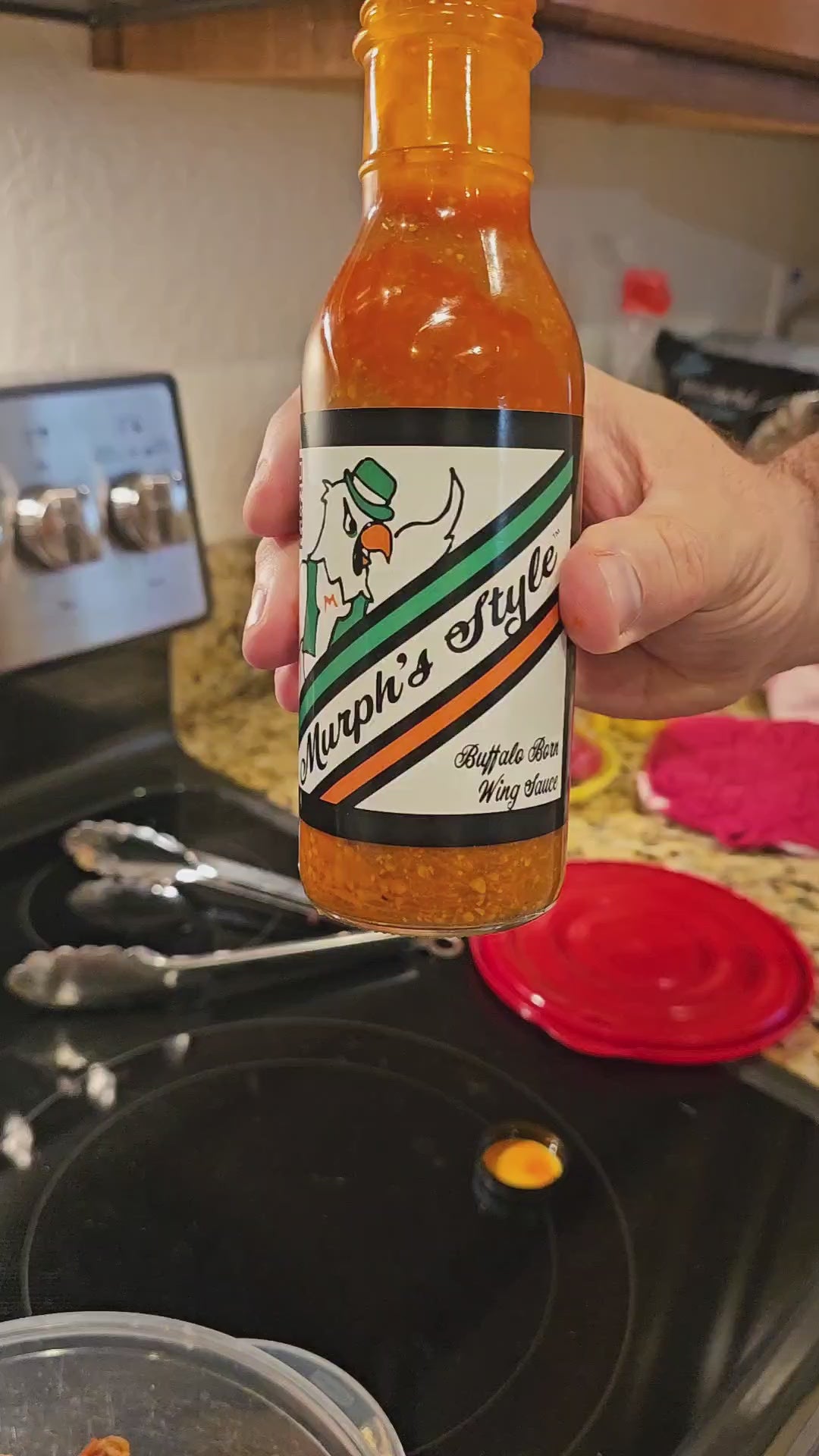 Murph's Wing Sauce pouring display