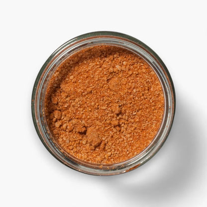 Jar of brown powder on a white background