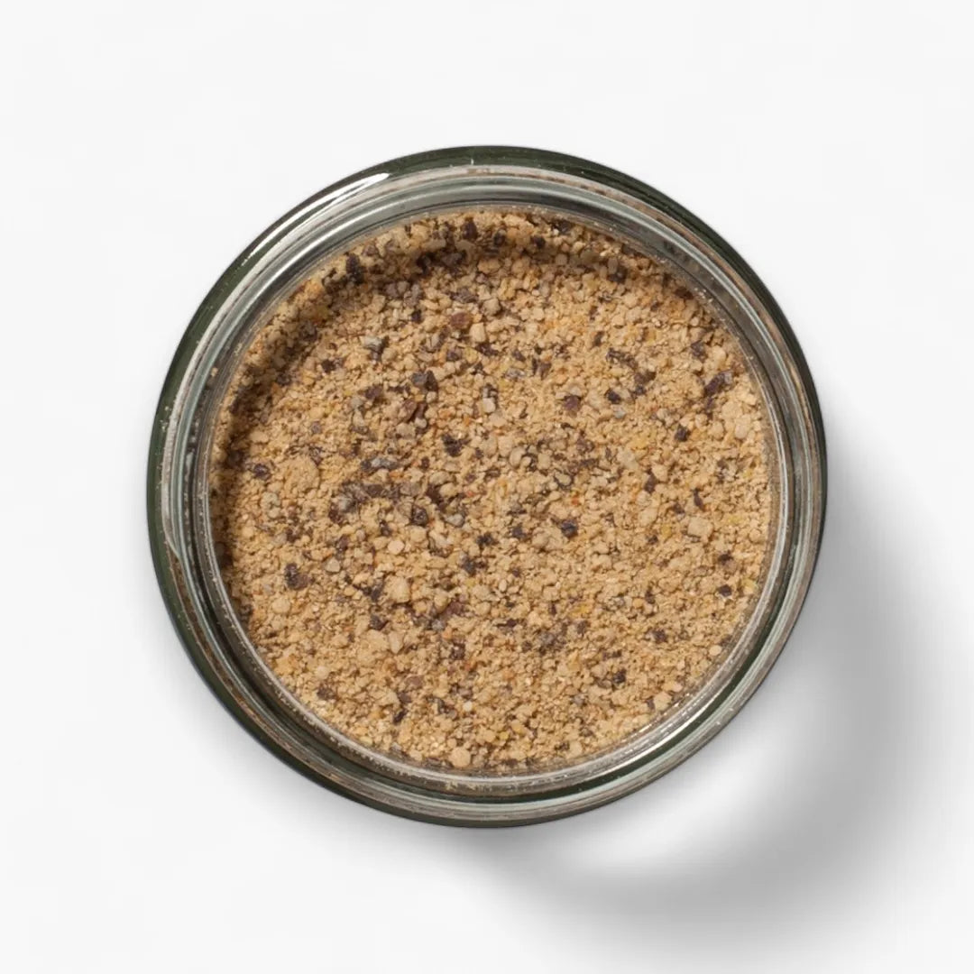 Jar of brown powder on a white background