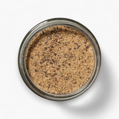 Jar of brown powder on a white background