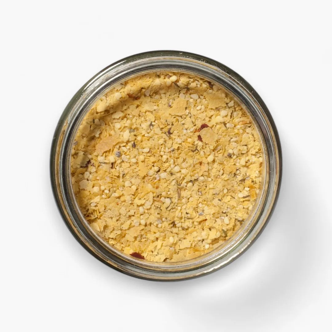Jar of popcorn blendon a white background