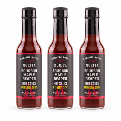 Three bottles of Cantina Royal Bourbon Maple Reaper Hot Sauce