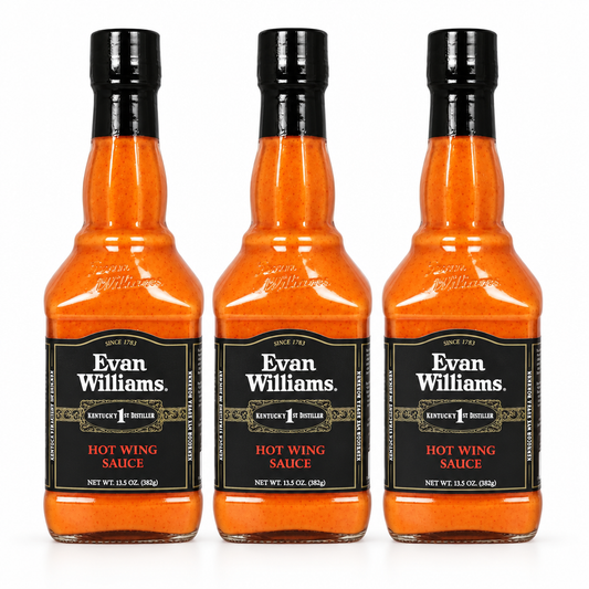 Three bottles of Evan Williams Hot Wing Sauce