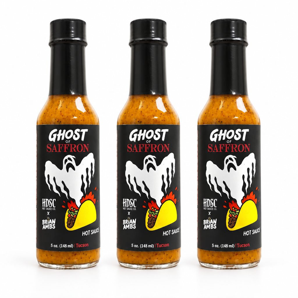 Three bottles of High Desert Ghost of Saffron Hot Sauce