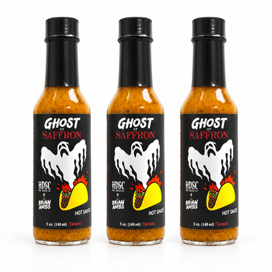 Three bottles of High Desert Ghost of Saffron Hot Sauce