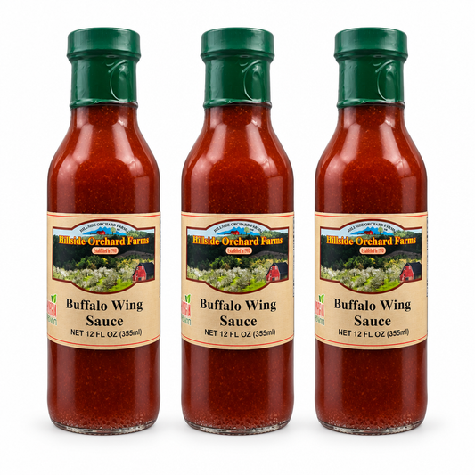 Three bottles of Hillside Orchard Farms Buffalo Wing Sauce