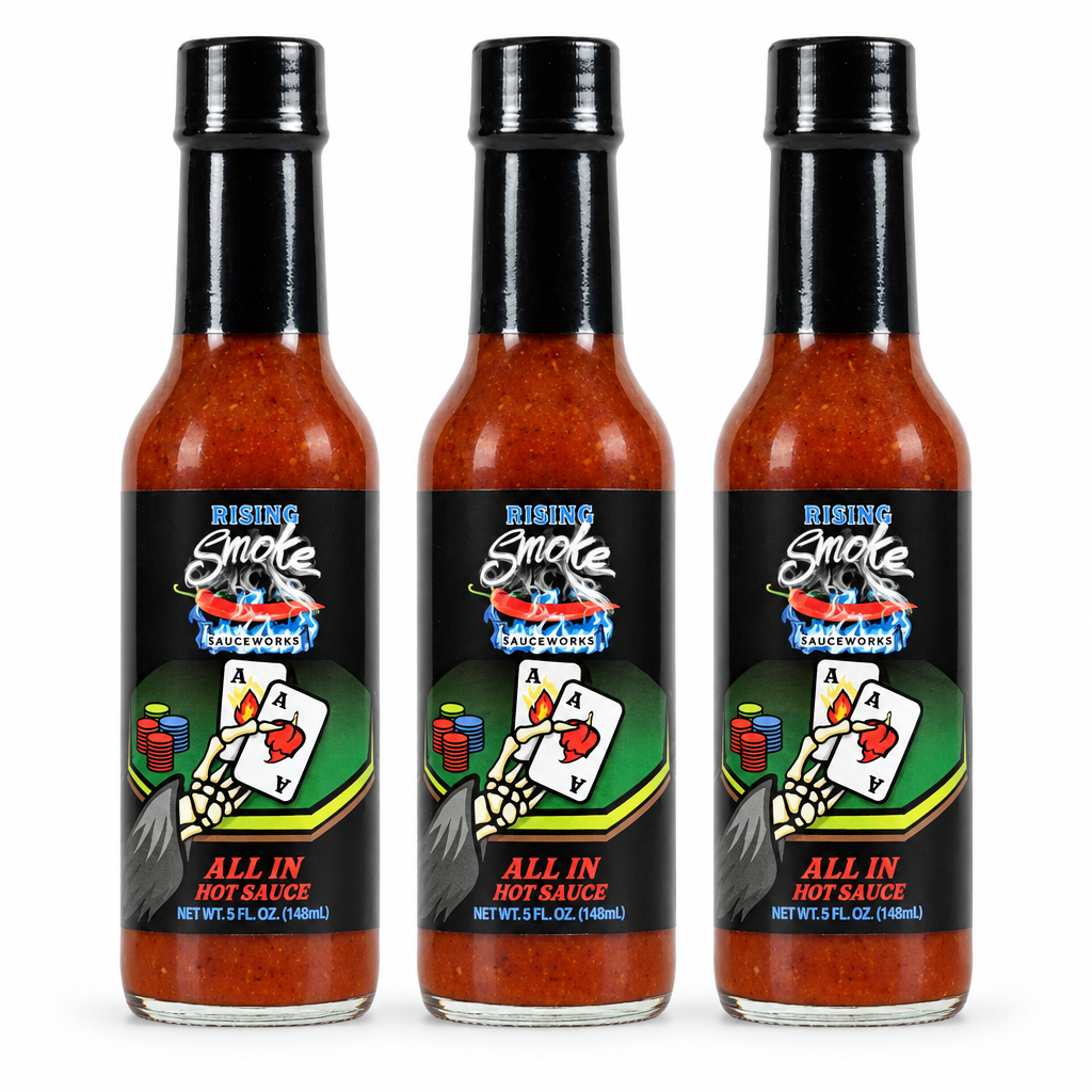 Three bottles of Rising Smoke All In hot sauce