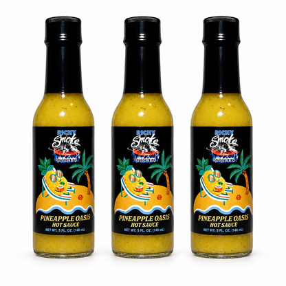 Three bottles of Rising Smoke Pineapple Oasis Hot Sauce