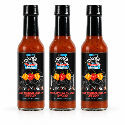 Three bottles of Rising Smoke Smoldering Embers Hot sauce